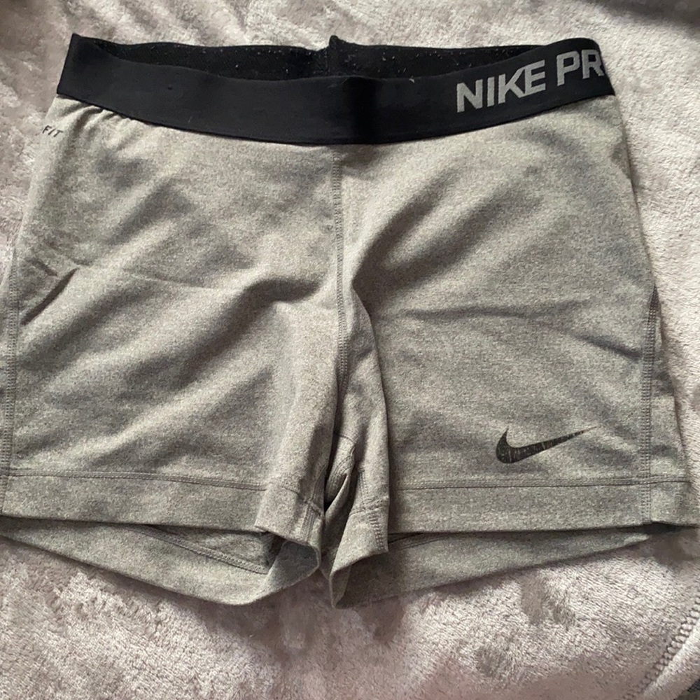Grey and black Nike pros